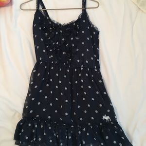 Navy ruffle front polka dot dress